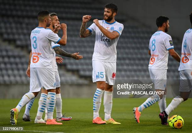 Marseille's Croatian defender Duje Caleta Car reacts after scoring a goal during the French friendly football match between Nimes Olympique and...