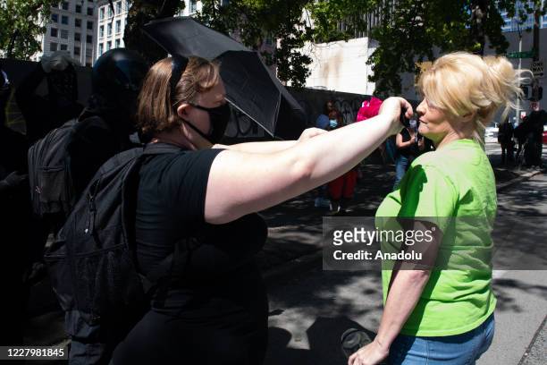 Confrontation between a pro police protester and a counter protester during the Seattle Police Officers Guildâs rally to stop defunding of the...