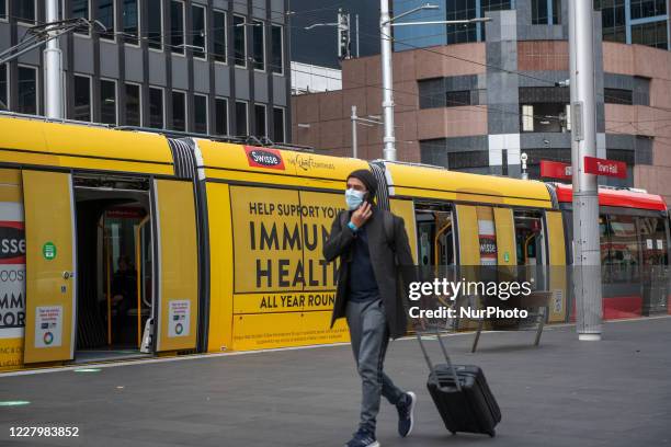 Sydneysider wearing face mask seen walking on the light rail platform at Townhall station in the CBD on August 10, 2020 in Sydney, Australia.