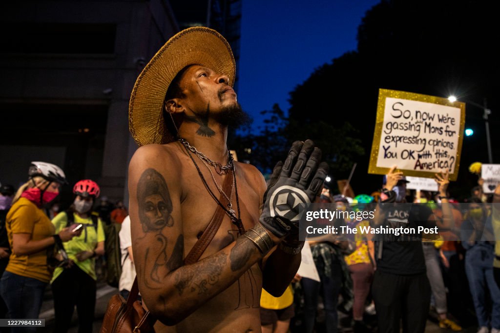 PORTLAND, OR - JULY 21: A man prays during the nightly protest