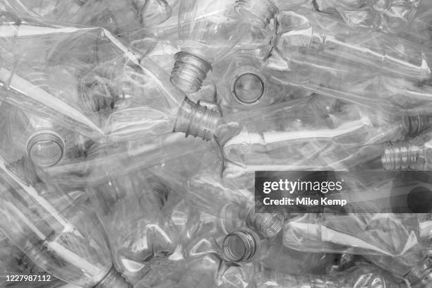 Image has been converted to black and white. Plastic water and drinks bottles for recycling on 1st July 2020 in London, United Kingdom. Single-use...