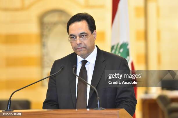 Lebanese Prime Minister Hassan Diab holds a press conference to announce his resignation after the Council of Ministers meeting at the Prime Ministry...