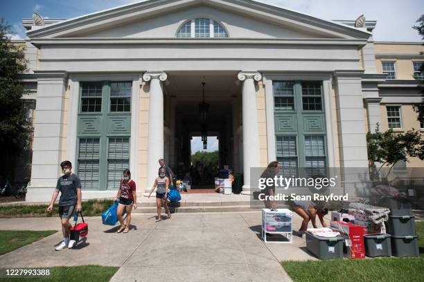 Students and their families move belongings at a campus dormitory at the University of South Carolina on August 10, 2020 in Columbia, South Carolina....