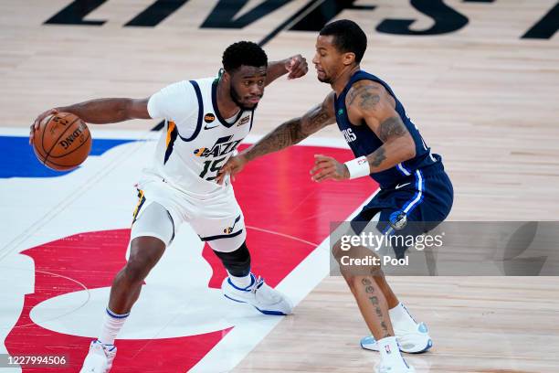 Utah Jazz's Emmanuel Mudiay tries to slip past =dmduring the second half of an NBA basketball game Monday, Aug. 10 in Lake Buena Vista, Fla. #AP...