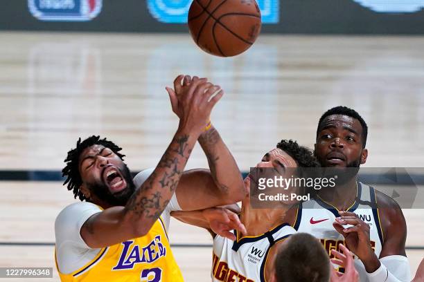 Anthony Davis of the Los Angeles Lakers battles Michael Porter Jr. #1 of the Denver Nuggets during the first half at The Arena at ESPN Wide World Of...