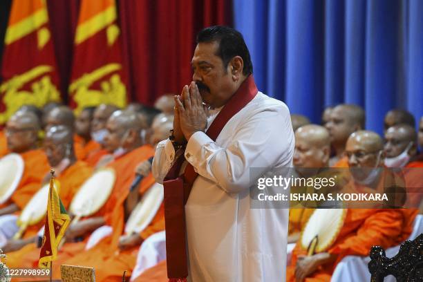 Sri Lanka's new Prime Minister Mahinda Rajapaksa looks on during a ceremony to formally assume duties for the next five-year term, at the Prime...