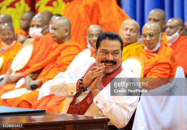 Sri Lankan prime minister Mahinda Rajapaksa greets his supporters and elected MPs before officially assuming duties at his office, Temple Trees, at...