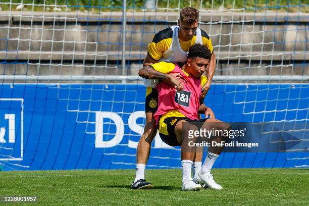 Thomas Meunier of Borussia Dortmund and Jadon Sancho of Borussia Dortmund look on during day 2 of the pre-season summer training camp of Borussia...