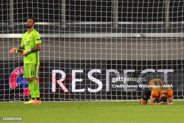 Ruben Vinagre and Rui Patricio of Wolverhampton Wanderers look dejected at the end of the UEFA Europa League Quarter Final between Wolves and Sevilla...