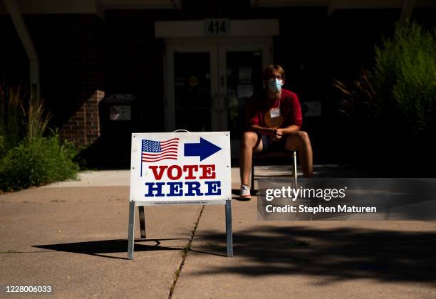 An election judge directs voters outside a polling place in the Pearl Park Recreation Center on August 11, 2020 in Minneapolis, Minnesota. Amongst...