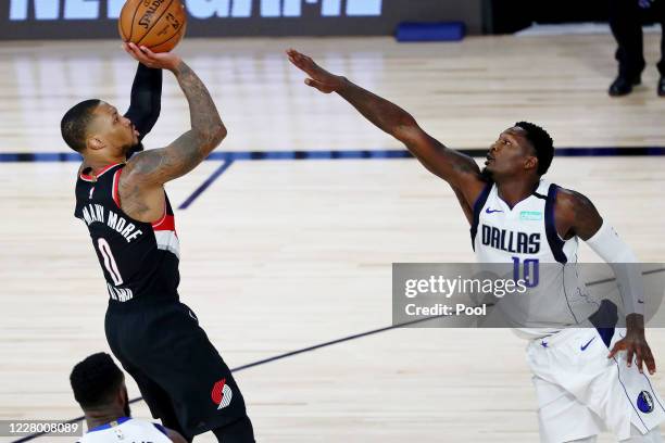 Damian Lillard of the Portland Trail Blazers shoots the ball against Dorian Finney-Smith of the Dallas Mavericks during the second half at The Field...