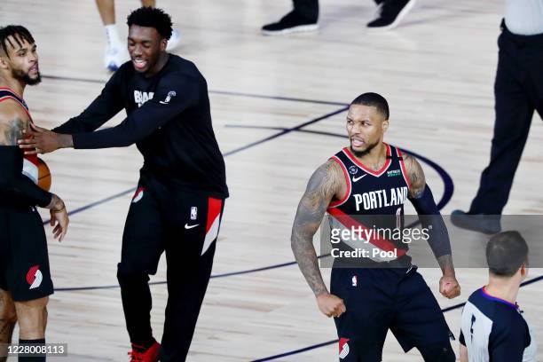 Damian Lillard of the Portland Trail Blazers celebrates after defeating the Dallas Mavericks 134-131 at The Field House at ESPN Wide World Of Sports...