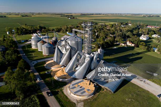 In this aerial image from a drone, damaged grain bins are shown at the Heartland Co-Op grain elevator on August 11, 2020 in Luther, Iowa. Iowa Gov....