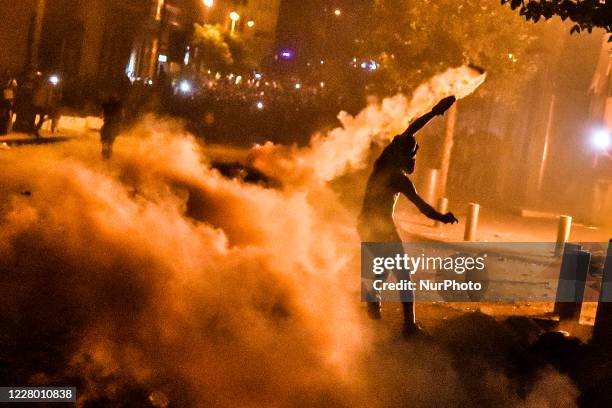 People take part in an anti-government protest on August 11, 2020 in Beirut, Lebanon. Last week's explosion, which killed more than 200 people and...