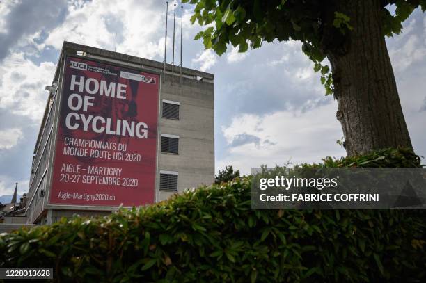 This photograph taken on August 10 shows a giant banner of the UCI 2020 World Cycling Championships in Aigle, Switzerland, amid the COVID-19...