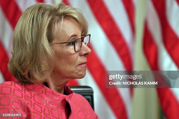 Secretary of Education Betsy DeVos attends the "Getting America's Children Safely Back to School" event in the State Room of the white House in...