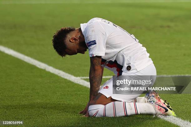 Paris Saint-Germain's Brazilian forward Neymar reacts after missing to score a goal during the UEFA Champions League quarter-final football match...