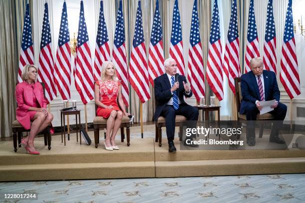 Vice President Mike Pence, second right, speaks while Betsy DeVos U.S. Secretary of education, from left, Kellyanne Conway, senior advisor to...