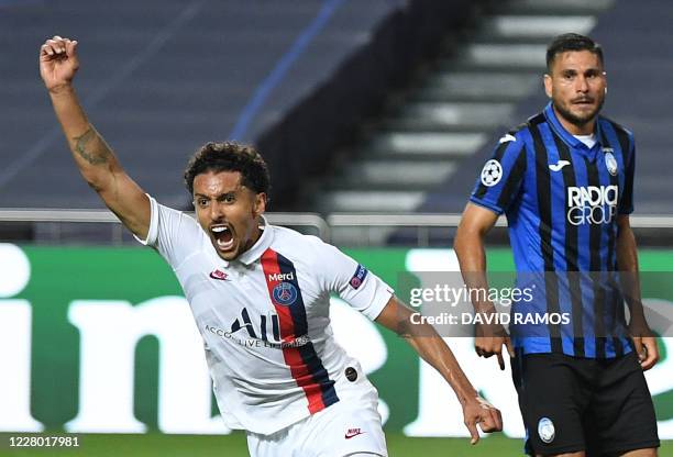 Paris Saint-Germain's Brazilian defender Marquinhos celebrates after scoring a goal during the UEFA Champions League quarter-final football match...