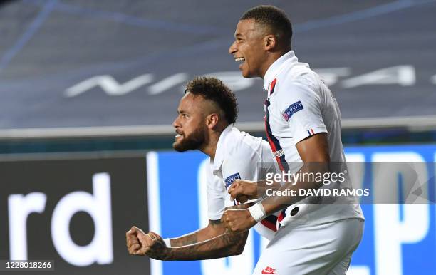 Paris Saint-Germain's French forward Kylian Mbappe and Paris Saint-Germain's Brazilian forward Neymar celebrate after Paris Saint-Germain's Cameroon...