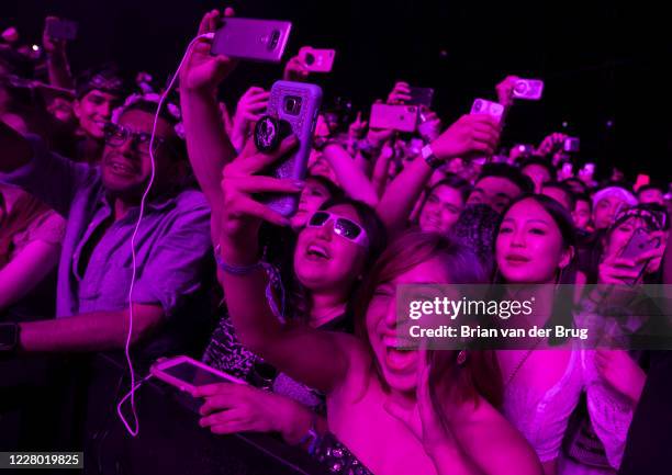 Fans watch BLACKPINK on the Sahara stage at the Coachella Valley Music and Arts Festival on the Empire Polo Club grounds in Indio, Calif., on April...