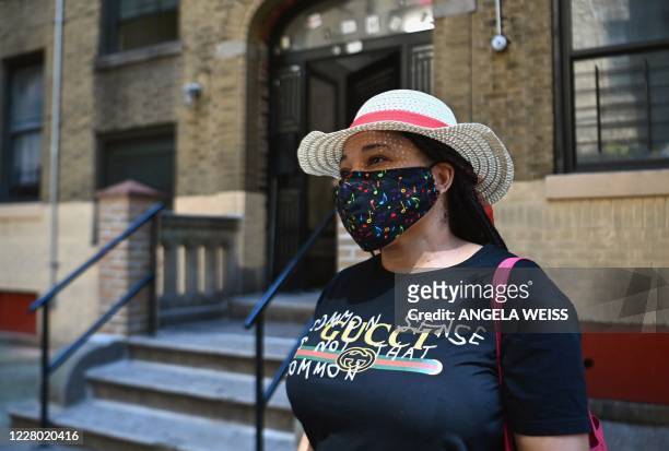 Yudy Ramirez who got laid off from her job in March and is unable to pay rent stands outside her apartment complex on August 10, 2020 in the Bronx...