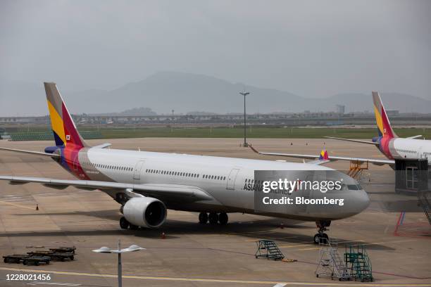 Asiana Airlines Inc. Aircraft sit on the tarmac at Incheon International Airport in Incheon, South Korea, on Wednesday, Aug. 12, 2020. Income from...