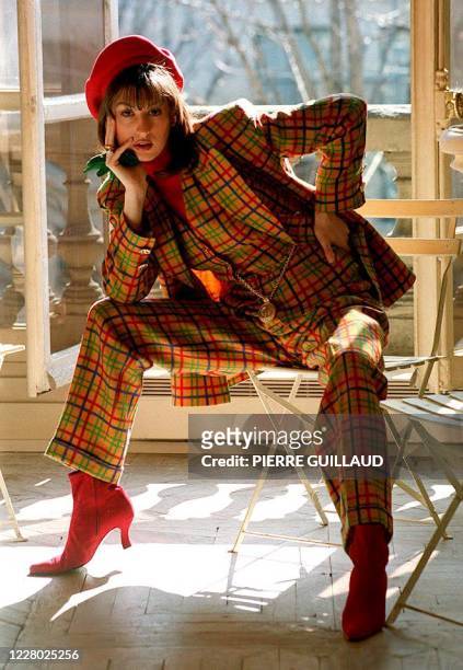Guy Laroche model wears a multicolored Scotch-plaid pants-suit with vest in a sneak-preview of the fall-winter 93-94 collection, 08 Mar.