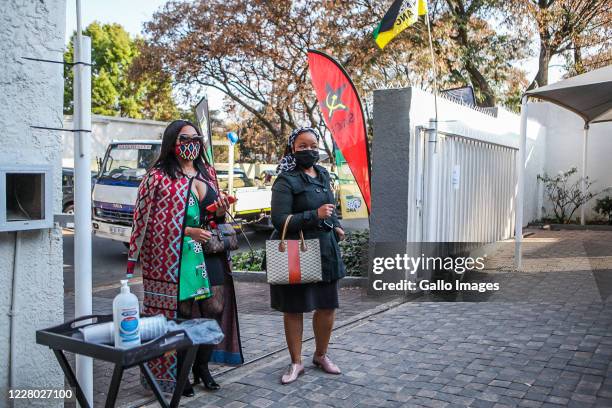 Family and friends watch the memorial service of the late struggle icon, John Nkadimeng via live streaming from the family home on August 12, 2020 in...