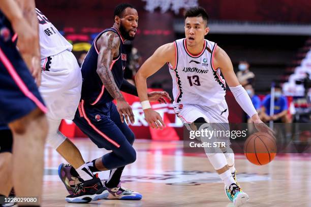 Guo Ailun of Liaoning Flying Leopards drives the ball during the Chinese Basketball Association match with Guangdong Southern Tigers in Qingdao in...