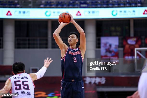 Yi Jianlian of Guangdong Southern Tigers takes a shot during the Chinese Basketball Association match with Liaoning Flying Leopards in Qingdao in...