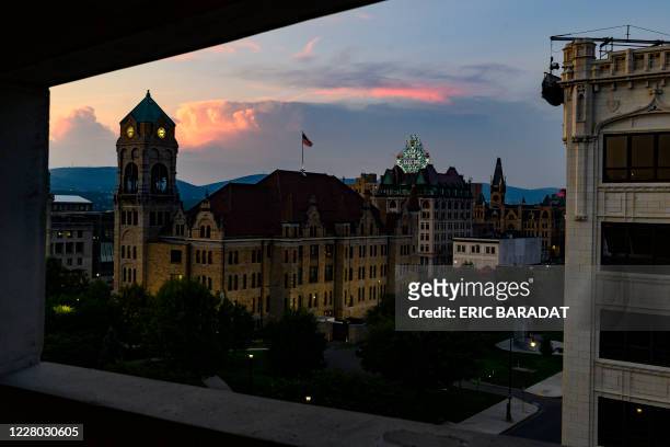 "Scranton, The Electric City" neon lights is seen as the sun sets over the Court House in the Downtown area of Scranton, Pennsylvania, on August 11,...
