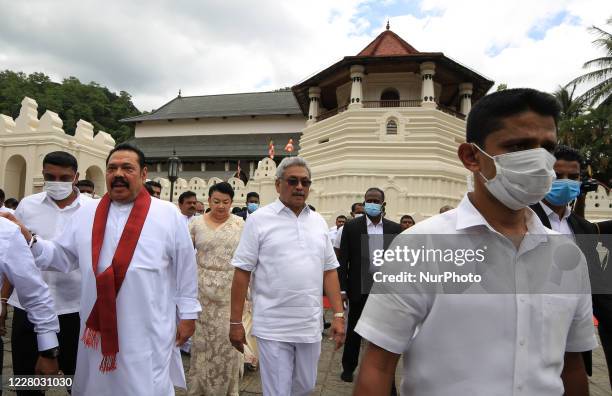 President Gotabaya Rajapaksa, his brothers prime minister Mahinda Rajapaksa and his wife Shiranthi Rajapaksa leave after attending an event for the...