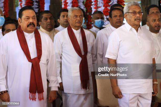 Sri Lankan prime minister Mahinda Rajapaksa , his elder brother Chamal Rajapaksa and younger brother, president Gotabaya Rajapaksa sing the national...