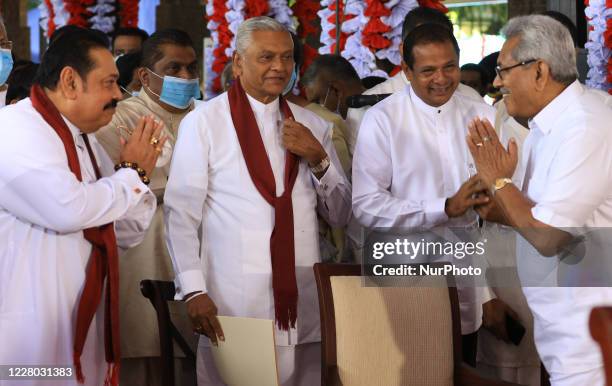 Sri Lankan prime minister Mahinda Rajapaksa greets his younger brother, president, Gotabaya Rajapaksa while their elder brother Chamal Rajapaksa...