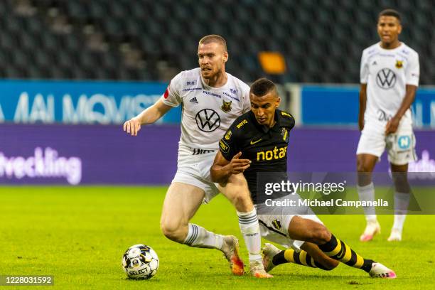 Nabil Bahoui of AIK in a duel with Thomas Isherwood of Ostersund FK during the Allsvenskan match between Djurgardens IF and Hammarby IF at Tele2...