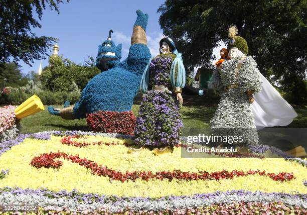 View of Jasmine and Genie movie characters is seen during the opening of "Mult-Land" exhibition on the Singing field in Kiev, Ukraine, on August 14,...