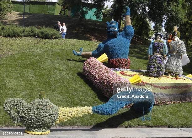 View of Jasmine and Genie movie characters is seen during the opening of "Mult-Land" exhibition on the Singing field in Kiev, Ukraine, on August 14,...