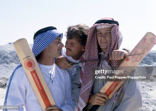 England cricketers Graeme Fowler , Ian Botham and David Gower in the desert, circa March 1983. They were in Sharjah for the Bukhatir Double Wicket...