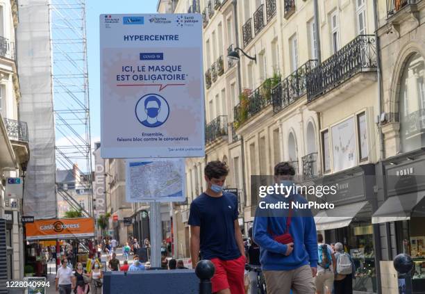 People walk downtown Nantes, France on August 14, 2020. Faced with the multiplication of cases of Coronavirus / Covid-19, the city of Nantes has...