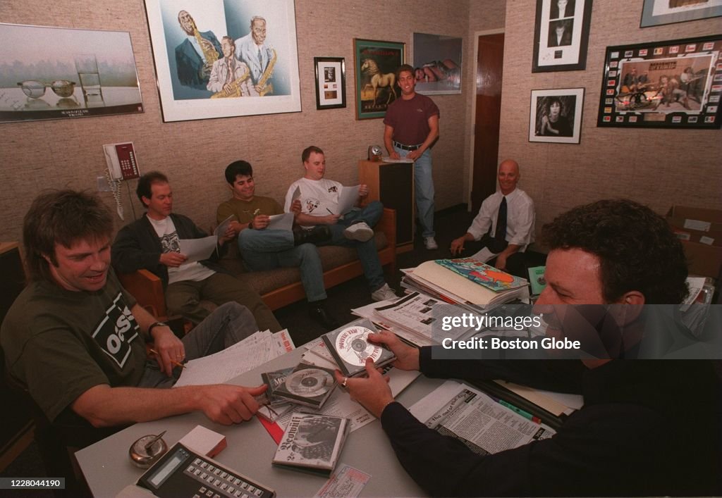Wbcn Radio D.J. Oedipus, right, talks with his staff at WBCN radio station ...