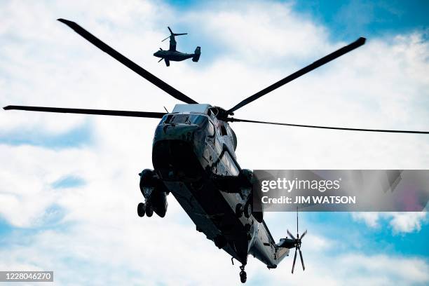 Osprey flies overhead as Marine One and US President Donald Trump land at the Wall Street Landing Zone in New York, NY, on August 14, 2020 where the...