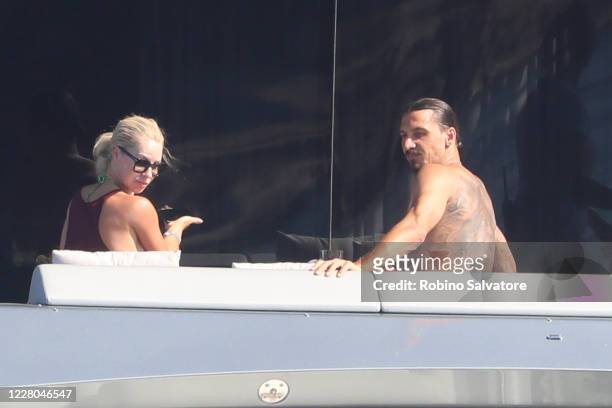 Helena Seger and Zlatan Ibrahimovic are seen on a yacht on August 14, 2020 in Sassari, Italy.