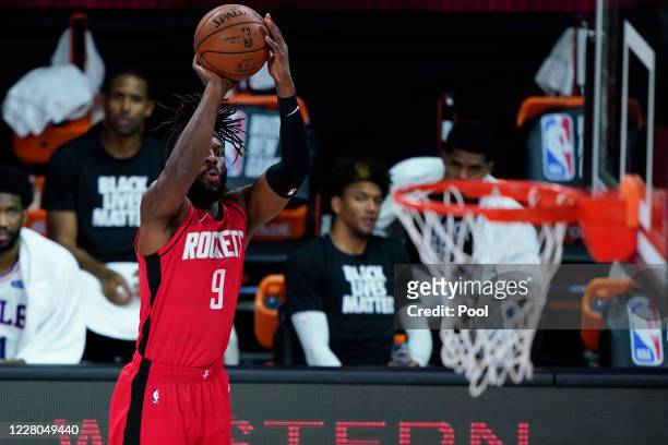 DeMarre Carroll of the Houston Rockets shoots agains the Philadelphia 76ers during the second half of an NBA basketball game at the ESPN Wide World...