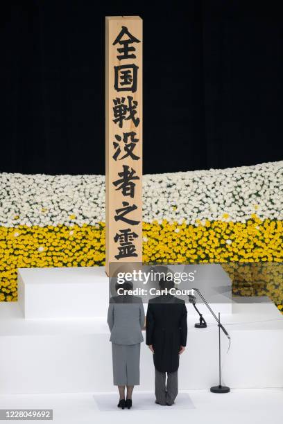 Emperor Naruhito and Empress Masako of Japan bow as they attend a memorial service marking the 75th anniversary of Japan's surrender in World War II...