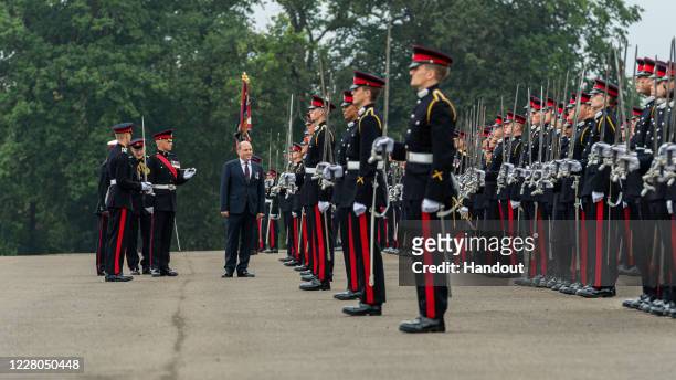 In this handout image provided by the Ministry of Defence, Defence Secretary Ben Wallace, representing Her Majesty The Queen, acts as Inspecting...