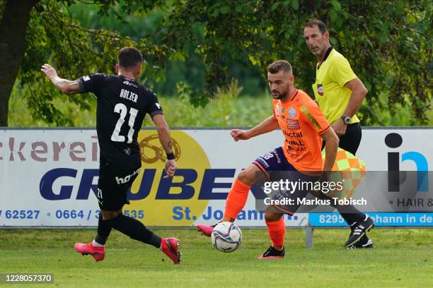 Daniel Holzer of Banik Ostrava and Juergen Heil of Hartberg during the Friendly match between TSV prolactal Hartberg and FC Banik Ostrava at...