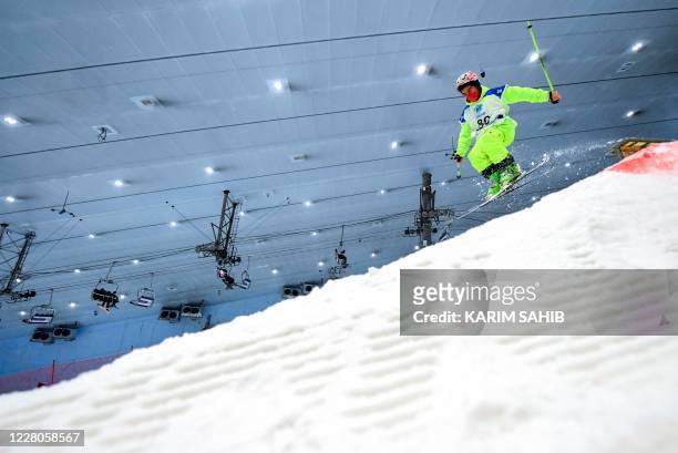 Graphic content / A participant competes in a skiing contest as part of the "DXB Snow Week" at the Ski Dubai indoor resort in the Gulf emirate on...