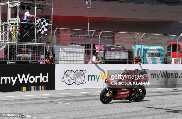 Ducati's Italian rider Andrea Dovizioso rides his bike to win the Moto GP Austrian Grand Prix at the Red Bull Ring circuit in Spielberg, Austria on...