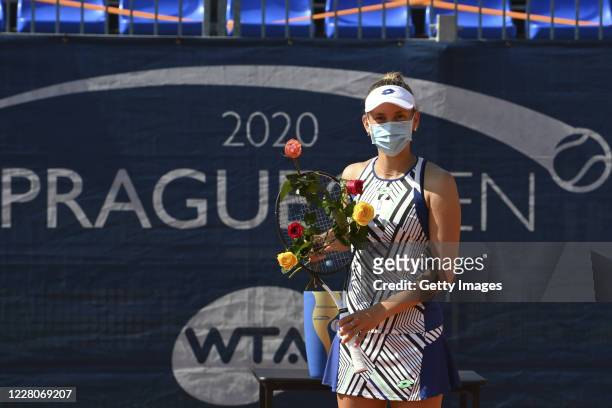 Runner-up Elise Mertens of Belgium attends the award ceremony after losing the Women's Singles Final against Simona Halep of Romania during the WTA...